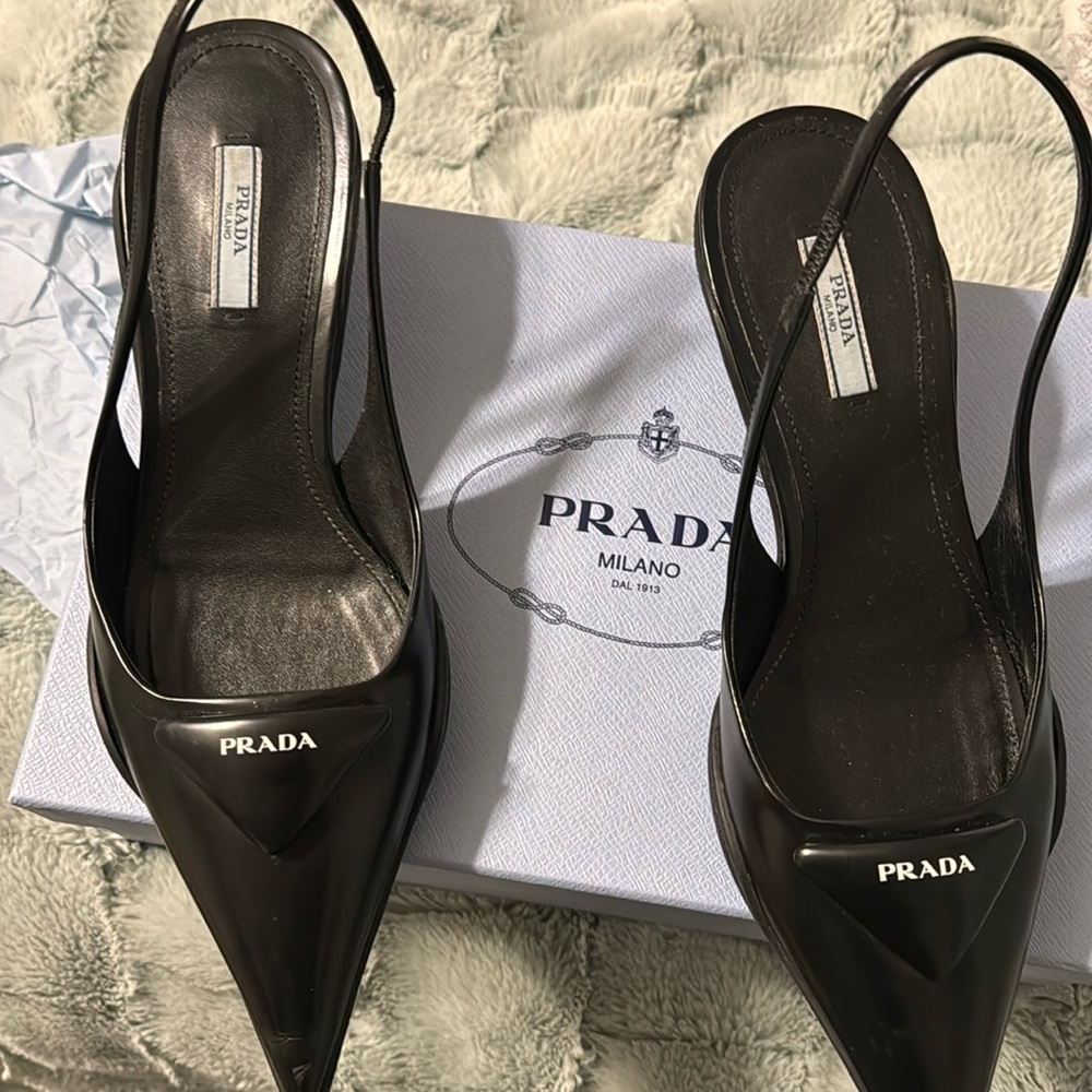 Prada at its finest !Barely worn .fits comfortably and a wardrobe piece.